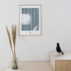 a thin oak frame hanging on a white wall with the art print inside with the title; Echo 02