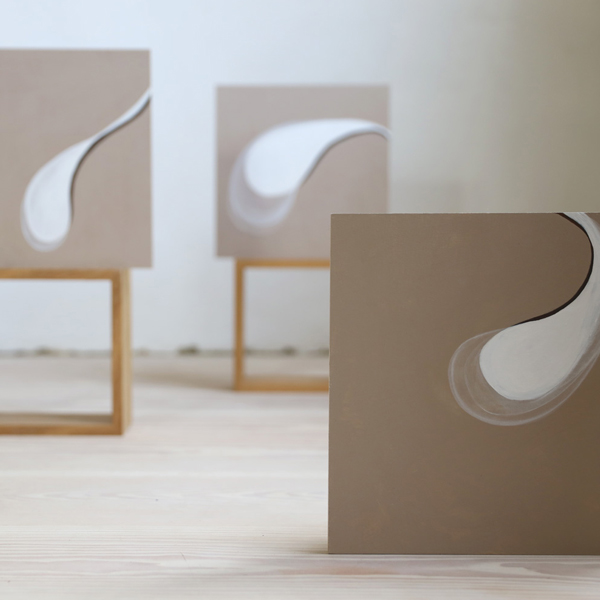 Three artworks in beige and white colour scheme