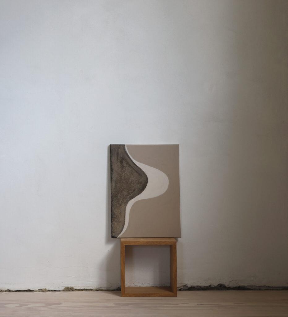 An acrylic painting in a white room