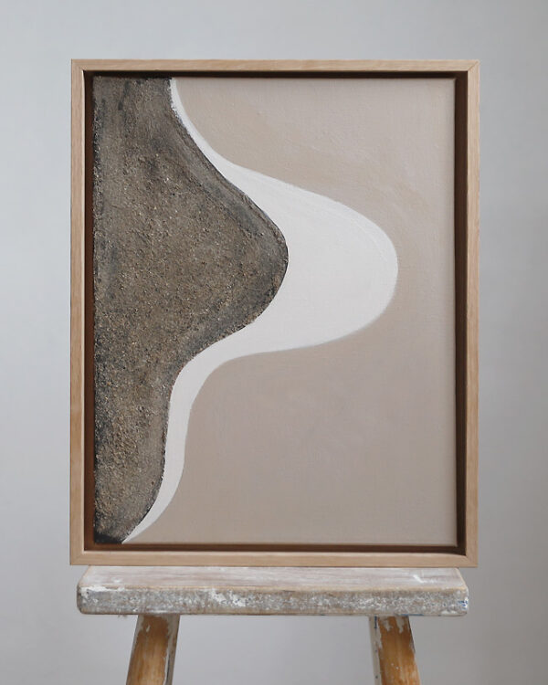 Flow 01 mixed media. artwork in beige, brown and white hues in an oak frame, placed on a stool